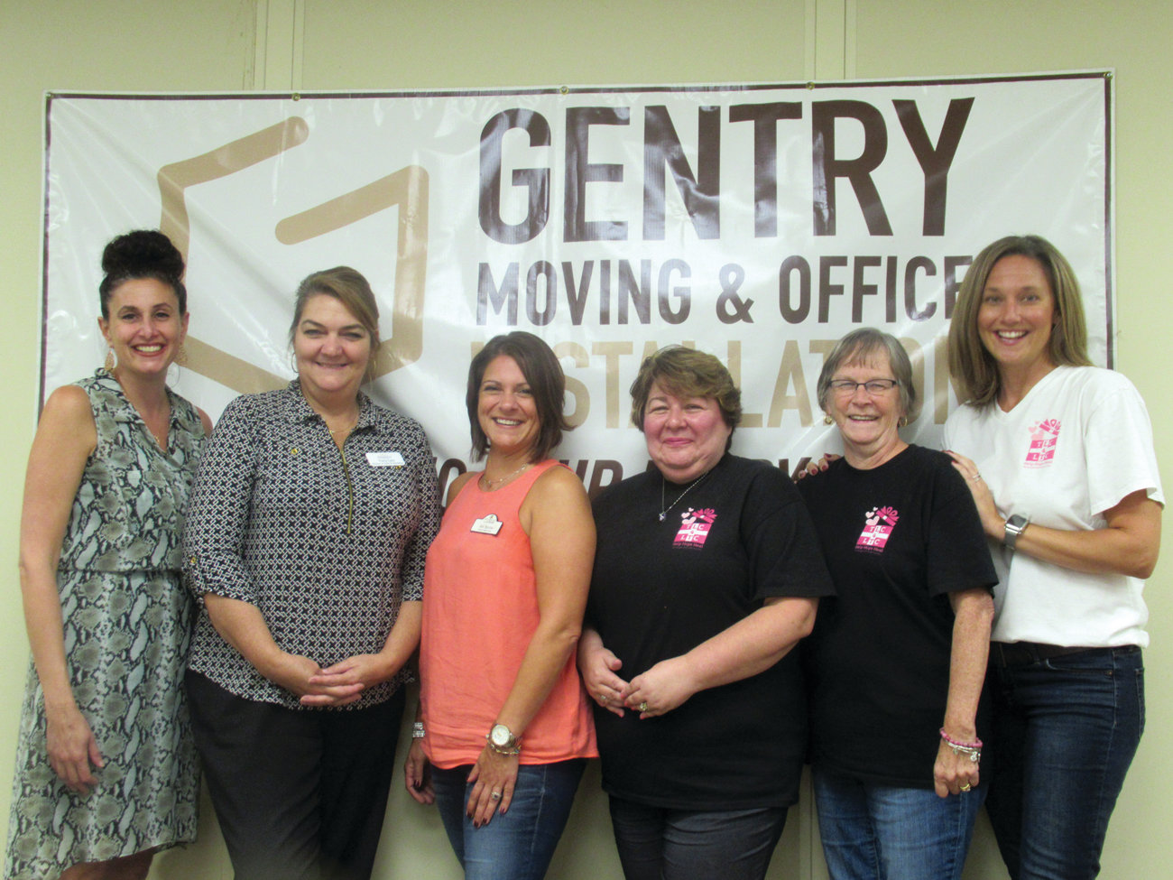SPECIAL SUPPORTERS: Christine Crum, left, who owns and operates Gentry Moving & Storage in Cranston, co-chaired the Cornhole Elimination Tournament and hosted the fundraiser when the event was threatened by rain. She’s joined by committee members Tracy Cale, Jen Burns, Lisa Ferreira and Karen Morin. Not pictured are Kelly Marot and Pam Marchetti.